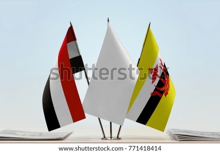 Flags of Yemen and Brunei with a white flag in the middle