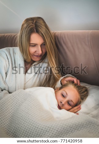 Happy loving family. Mother and teen girl daughter smiling, playing, kissing at home