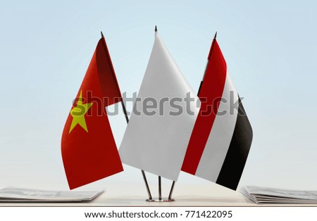 Flags of Vietnam and Yemen with a white flag in the middle