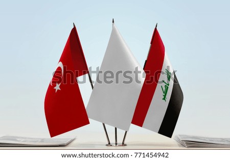 Flags of Turkey and Iraq with a white flag in the middle
