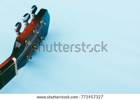 Acoustic Guitar Over Blue Background 
