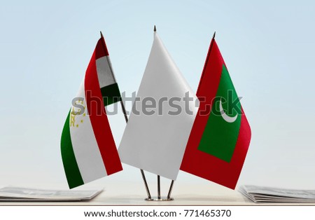 Flags of Tajikistan and Maldives with a white flag in the middle