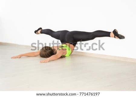 Beautiful slender girl doing sports exercises. Exercise sports fitness concept of health.