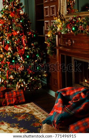 Christmas room with a Christmas tree and fireplace. Concept of Happy Christmas, New Year, holiday, background. Vertical view