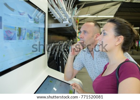 couple shopping online in a store