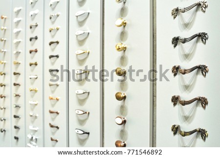 samples of metal and plastic handles for furniture