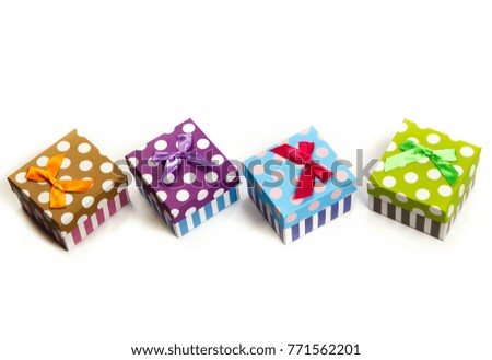 Group of gifts from multi-colored boxes with ribbons on white background
