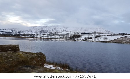 Pendle hill covered with snow. England