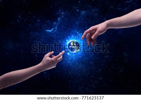 Male god hands about to touch the earth globe in the galaxy with bright shining stars and blue light illustration concept. Elements of this image furnished by NASA.