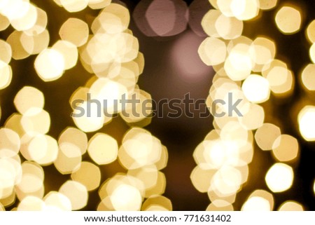 Abstract bright white,yellow and golden Lights blurred bokeh background,blurry lights,glitter sparkle from christmas lights night party.Christmas and new year holiday concept with copy space.