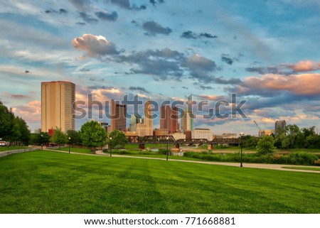 Scioto River and downtown Columbus Ohio skyline at John W. Galbreath Bicentennial Park at dusk