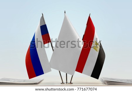 Flags of Russia and Egypt with a white flag in the middle
