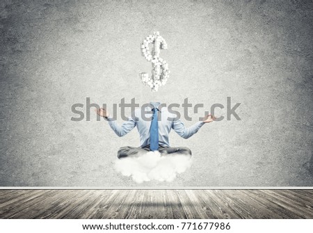 Meditating businessman with dollar sign instead of his head