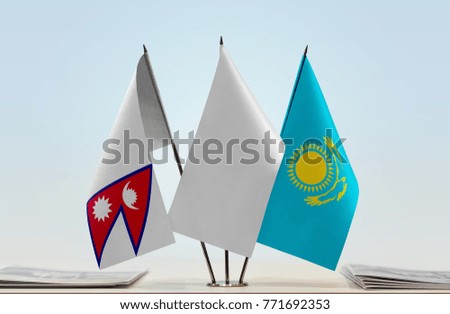 Flags of Nepal and Kazakhstan with a white flag in the middle