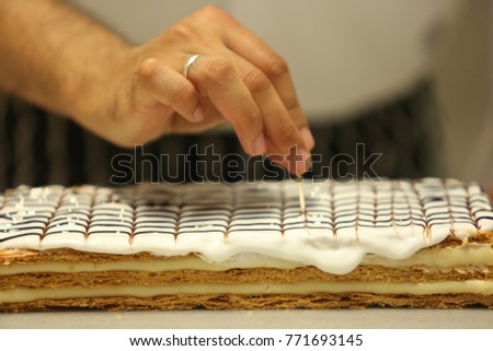 Chef making 'Vanilla cake' in the bakery shop.