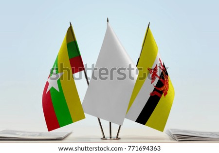 Flags of Myanmar and Brunei with a white flag in the middle