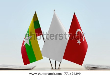 Flags of Myanmar and Turkey with a white flag in the middle