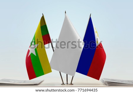 Flags of Myanmar and Philippines with a white flag in the middle