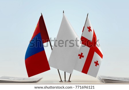 Flags of Mongolia and Georgia with a white flag in the middle
