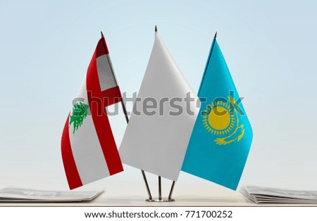 Flags of Lebanon and Kazakhstan with a white flag in the middle
