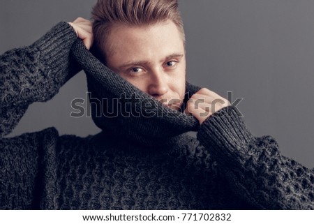 Young man freestyle wearin sweater studio concept