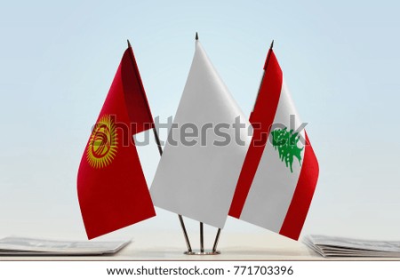 Flags of Kyrgyzstan and Lebanon with a white flag in the middle