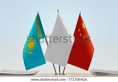 Flags of Kazakhstan and China with a white flag in the middle
