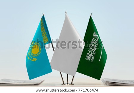 Flags of Kazakhstan and Saudi Arabia with a white flag in the middle