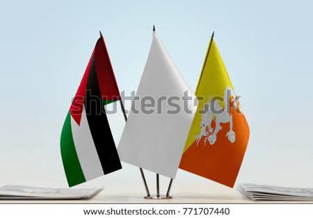 Flags of Jordan and Bhutan with a white flag in the middle