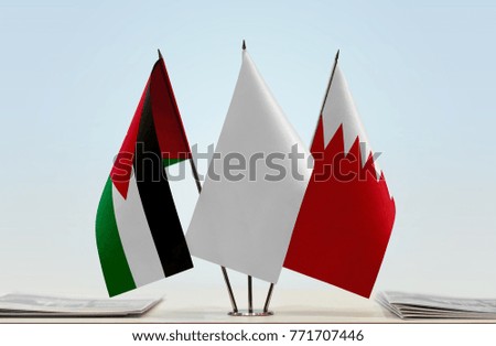 Flags of Jordan and Bahrain with a white flag in the middle
