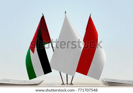 Flags of Jordan and Indonesia with a white flag in the middle