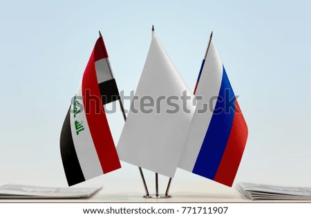Flags of Iraq and Russia with a white flag in the middle