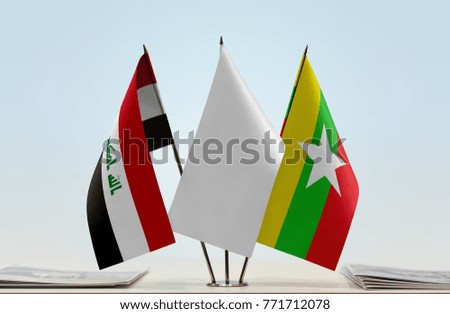 Flags of Iraq and Myanmar with a white flag in the middle
