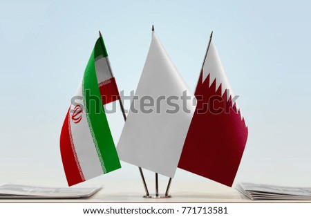 Flags of Iran and Qatar with a white flag in the middle