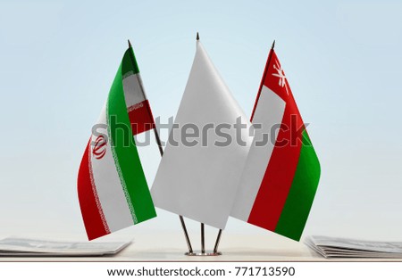 Flags of Iran and Oman with a white flag in the middle