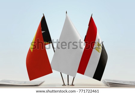 Flags of East Timor and Egypt with a white flag in the middle