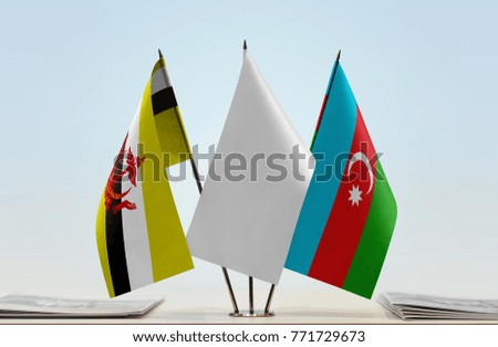 Flags of Brunei and Azerbaijan with a white flag in the middle