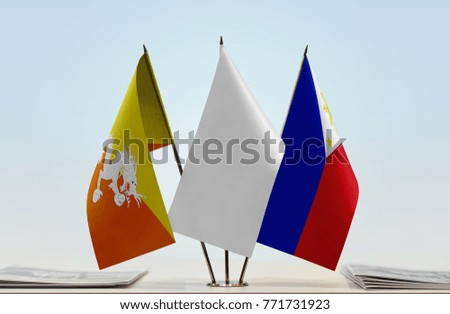 Flags of Bhutan and Philippines with a white flag in the middle