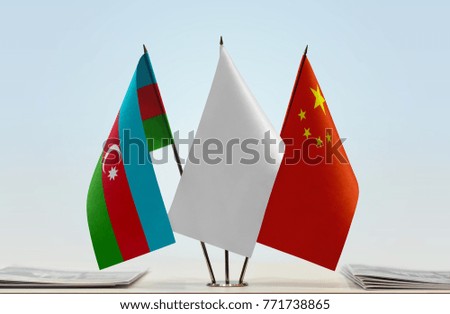 Flags of Azerbaijan and China with a white flag in the middle