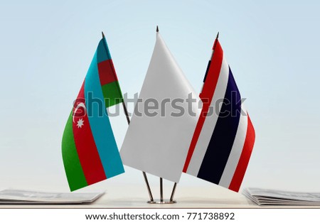 Flags of Azerbaijan and Thailand with a white flag in the middle