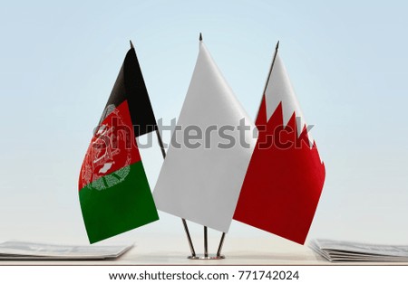 Flags of Afghanistan and Bahrain with a white flag in the middle