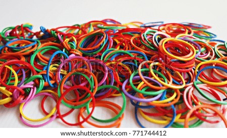 Multi color rubber bands on white background. 