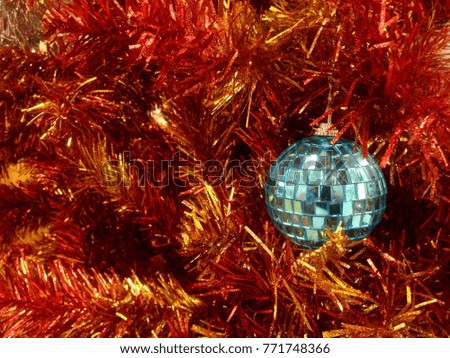 Red and Gold of Tinsel with glittering ball
