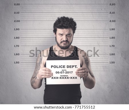 Caught gangster in jail with table on his hand.