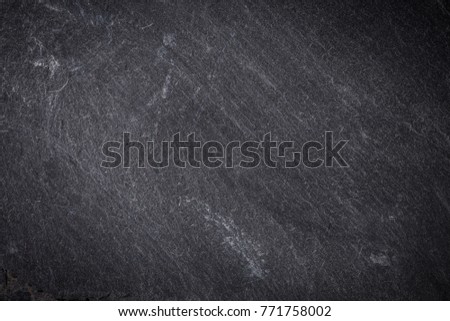 Dark grey and black slate background or texture Royalty-Free Stock Photo #771758002