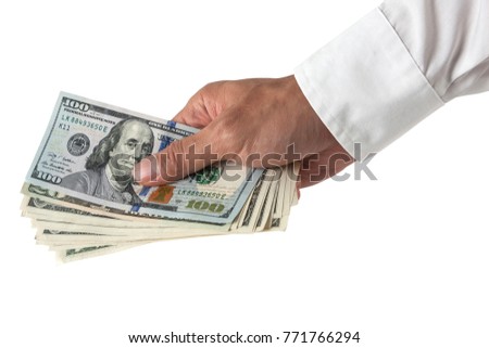 Hand holding cash
