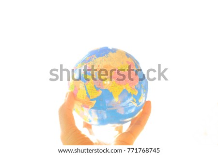 The concept of our global in our hand. The global map model in hand with isolate white background. Every country are in the same planet. The earth give us land, water, life, food, air and etc.