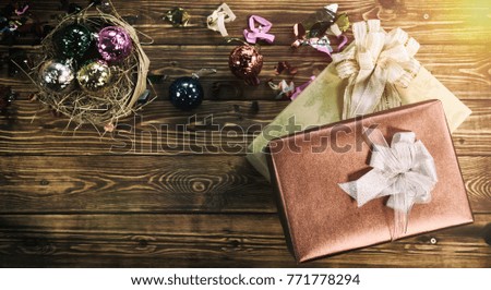Top view of gift box on wood background with christmas decoration