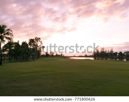 Landscape of golf course before sunset with water reflection