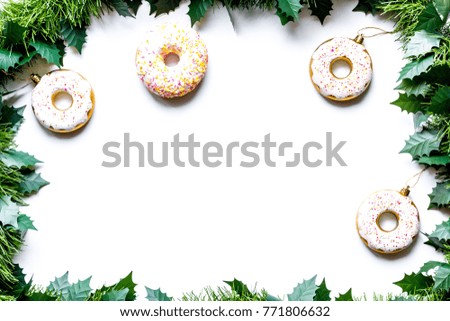 Patterns and mockups of white and pink donuts with mistletoe and Christmas toys on the white background flat lay